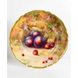 A Royal Worcester plate by Horice Price, painted with peaches and cherries to a mossy ground, 22cm