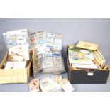 A large group of vintage cigarette cards and cigarette card albums.