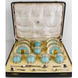 A cased set of Royal Worcester cups and saucers, with turquoise and gilded decoration, puce mark for