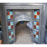 A cast iron fireplace with tile inset, circa 1912.