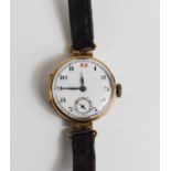 A 9ct gold 1920s ladies wristwatch, the Arabic dial with a subsidiary seconds dial, with a black