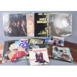 A group of vinyl records to include Rolling Stones LPs and singles, Carpenters, Abba, The