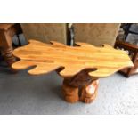A handmade oak leaf shaped table, 123cm long, 58cm tall.