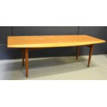 A Mid-Century Gordon Russell teak coffee table, 40cm high by 122cm wide.