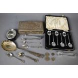 A group of silver items including a set of teaspoons, boxed, silver sugar nips, coins, together with