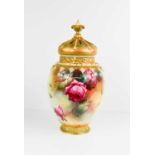 A Royal Worcester pot pourri vase and cover, painted all round with roses and insects with a pierced