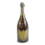 A bottle of Moet et Chandon, Dom Perignon vintage champagne, 1970, capsule present with some wear,