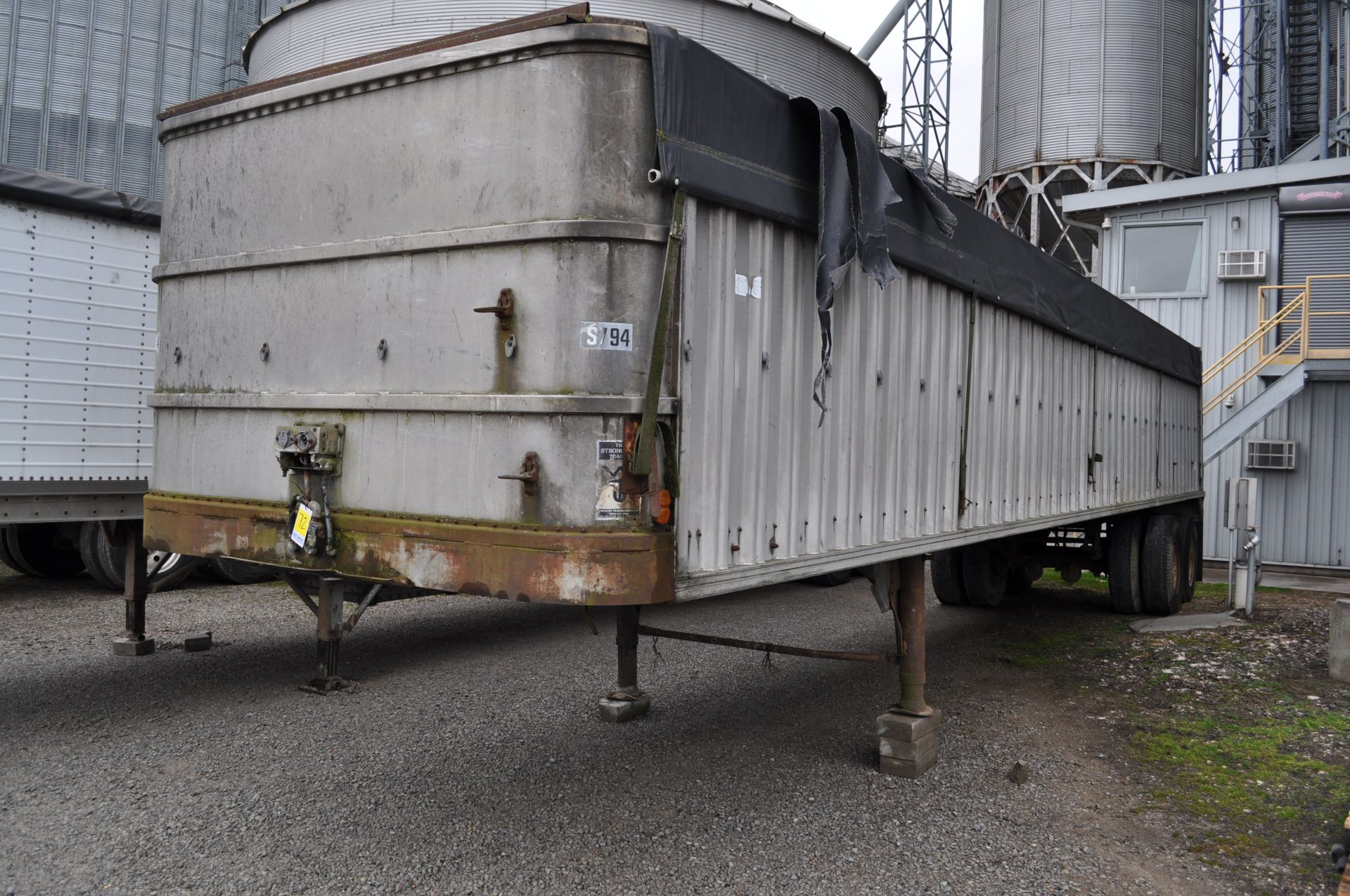 1973 37’ Wilson alum flat grain trailer, swinging rear door, tandem axle, spring ride, 10.00-20
