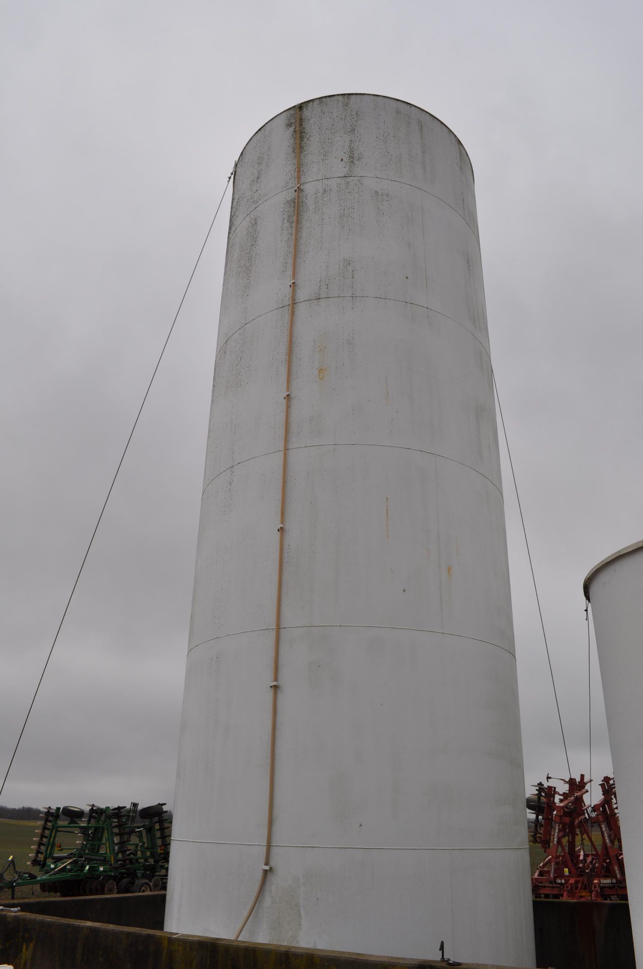 30,000 gallon steel upright tank, 3” plumbing, 5 yrs old, used for 28%