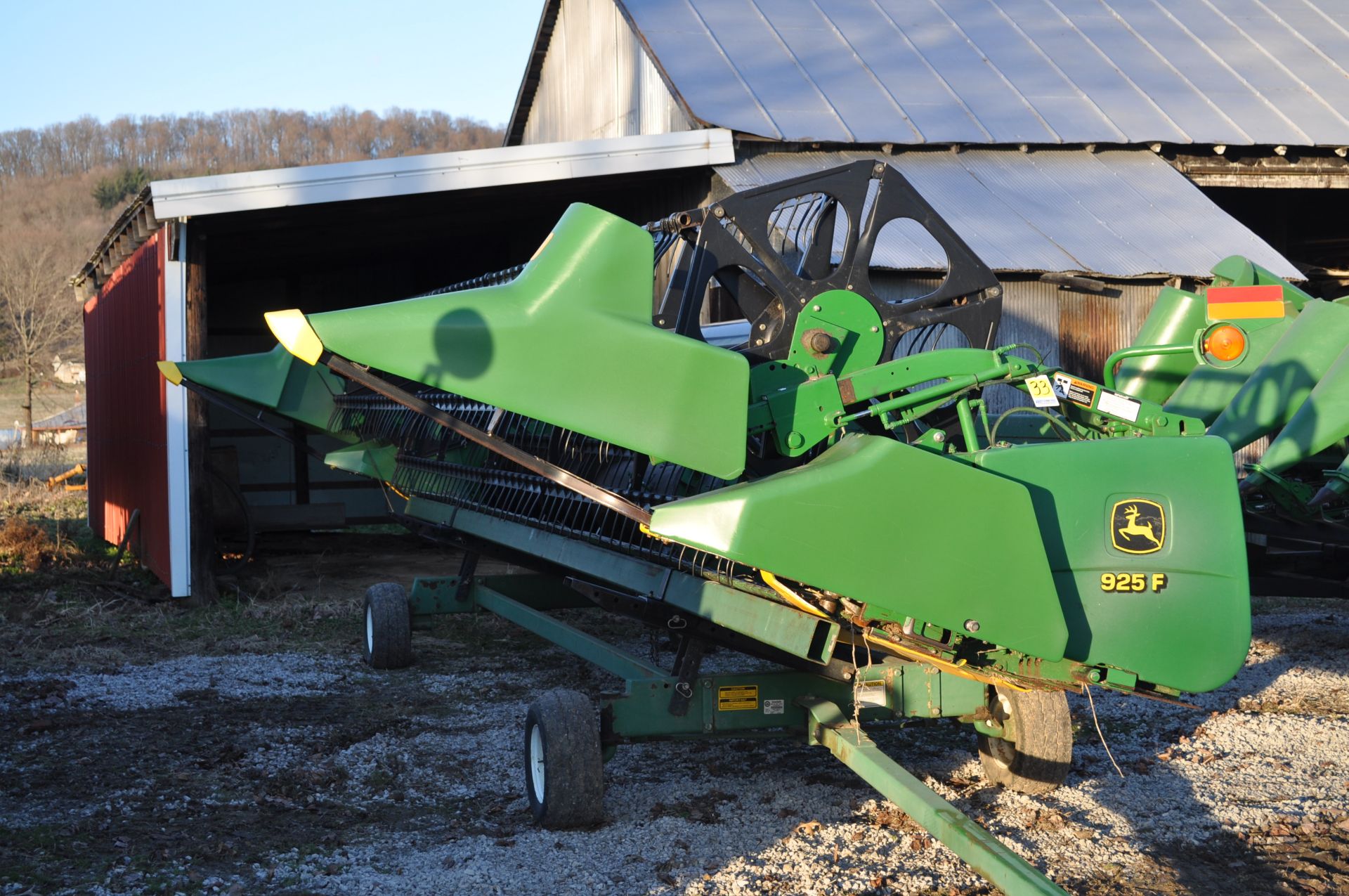 25’ John Deere 925 grain head, full finger, PTO shafts, poly skid shoes, hyd fore/aft