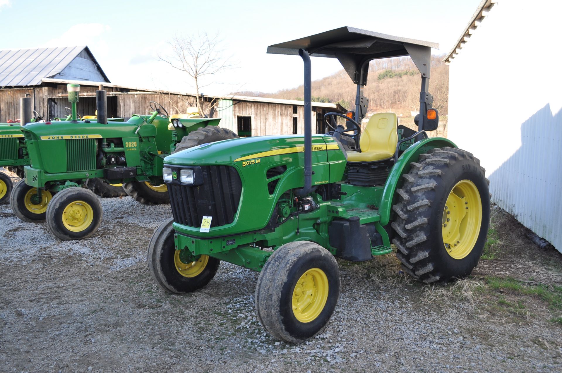 John Deere 5075M tractor, 16.9-30 rear, 11L-15 front, 2 hyd remotes, 3 pt, 540 PTO, Diesel