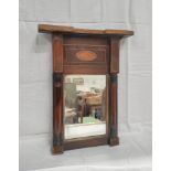 Early 19th century inlaid mahogany mirror with inlaid shell patera to the top above cylindrical