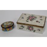 Small 18th century oval enamel patch box of lobed oval form, the hinged lid with floral panel