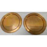 Pair of Birmingham Guild Arts and Crafts copper plates of circular form with impressed motifs to