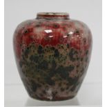 Ruskin Pottery small high fired vase of squat baluster form with red and black mottled crystalline
