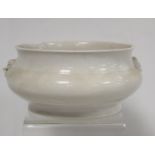 Antique Chinese blanc de chine porcelain censer of circular form with twin archaic taotie mask