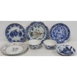 Seven items of Oriental 18th and 19th century porcelain, comprising: four plates, two rice bowls and