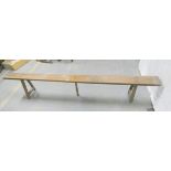 Arts and Crafts oak bench with rectangular plank top and jointed peg supports. 43cm high, 254cm