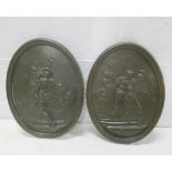 Pair of bronze oval wall plaques, depicting roman soldiers and females, 40cm x 30cm.