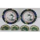 Pair of Japanese Kutani porcelain plates of lobed circular form, each depicting a duck in flight