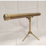 Table telescope, unsigned, upon circular stem and folding tripod, 42.7cm barrel.