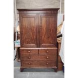 George III style mahogany linen press with two doors, above two short drawers and two long drawers