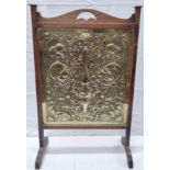 W.H. Mawson of Keswick, Arts & Crafts firescreen, the brass panel decorated with scrolling