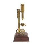 Cuff type microscope by Dollond, London, in a mahogany case with drawer, c1800, 40cm.