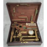 Brass Gould type microscope by Dollond, London, with accessories in mahogany case.