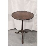 19th century mahogany wine table with pie crust edged top on reeded column and tripod supports. 70cm