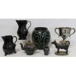 Brannam Pottery ovoid vase, the tube lined green scrolls on black glazed ground, impressed marks,