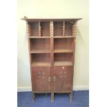 Arts & Crafts beech stationery cabinet with open racks and shelves above pair of cupboards
