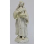 Mid 18th century Bow porcelain figure of a nun standing on domed circular base reading a prayer