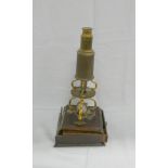 Brass Culpeper style microscope, unsigned upon scroll supports and moulded mahogany base, 37cm (a/