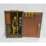 Brass binocular microscope by R & J Beck, No. 11699, 34cm, closed in mahogany case with accessories.