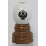 Russian porcelain presentation Easter egg with small polychrome enamel painted double headed