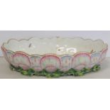 18th century English porcelain dish of lobed oval form with ten small rectangular plinth feet, the