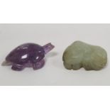 Small Chinese carved celadon jade toggle in the form of a sleeping lion dog, 4.5cm long and a