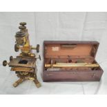 Brass spirit level in mahogany case and a microscope by Baker, London, incomplete (2).