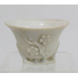 Antique Chinese Dehua Blanc de Chine porcelain libation cup with pierced naturalistic foot and