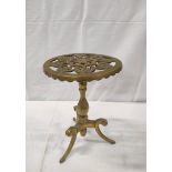 Victorian brass trivet with a detachable pierced circular top, on turned column and tripod splayed