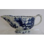 Mid 18th century Bow porcelain blue and white ribbed sauceboat in "Desirable Residence" pattern, the
