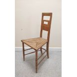 Arts & Crafts oak bedroom chair, the pierced rectangular back above trapezoid rush seat on ring