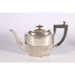 Victorian silver teapot of oval shape with gadrooned bottom half and lid, by John Millward Banks,