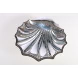 Edward VII silver dish of scallop shell shape, raised on three ball supports, by Atkin Brothers,