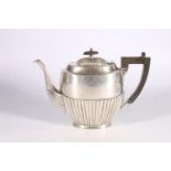 Edward VII silver hot water pot of oval shape with gadrooned bottom half and lid, by Joseph