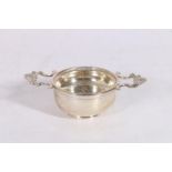 Elizabeth II silver tea strainer and bowl, makers mark JCL, London, 1959, 114g gross, 12.5cm