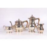 George VI silver four-piece tea set, raised on stepped oval socle base by Atkin Brothers, Sheffield,