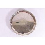 George III silver salver with pie-crust edge having feathered border, with central lion within