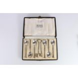 George V Arts & Crafts set of six silver teaspoons and matching pair of sugar tongs by Omar Ramsden,